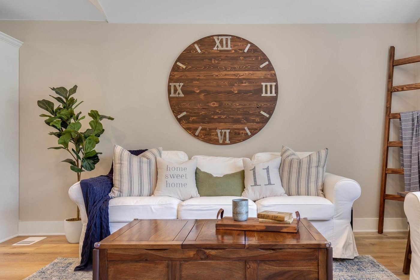 Photo of the interior design of the living room with a custom-made clock and professionally staged