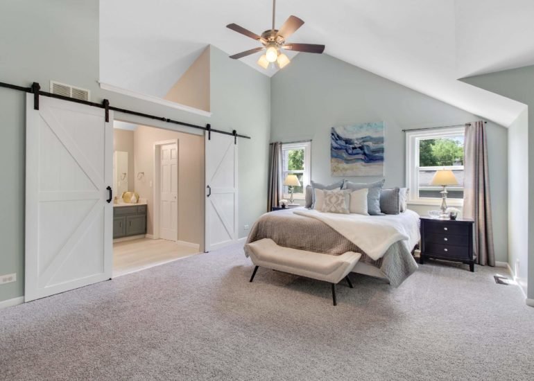 Master bedroom (primary bedroom) image, captured by a professional real estate photographer.